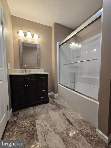 a bathroom with a sink and mirror