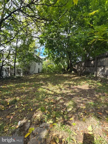 a view of outdoor space with deck and green space