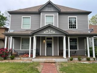 617 West Gandy Street, Unit 2 Denison, TX 75020 - Photo 1 of 15 a front view of a house with a garden and plants