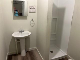617 West Gandy Street, Unit 2 Denison, TX 75020 - Photo 11 of 15 a bathroom with a sink and a mirror