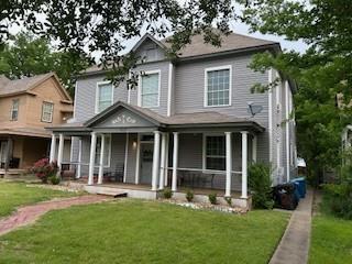617 West Gandy Street, Unit 2 Denison, TX 75020 - Photo 15 of 15 a front view of a house with a yard and porch