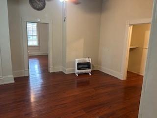 617 West Gandy Street, Unit 2 Denison, TX 75020 - Photo 6 of 15 a view of an empty room with wooden floor and a window