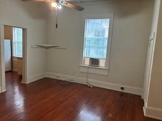617 West Gandy Street, Unit 2 Denison, TX 75020 - Photo 8 of 15 an empty room with wooden floor and windows
