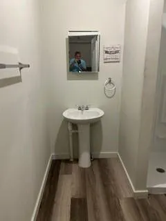 a bathroom with a sink and a mirror