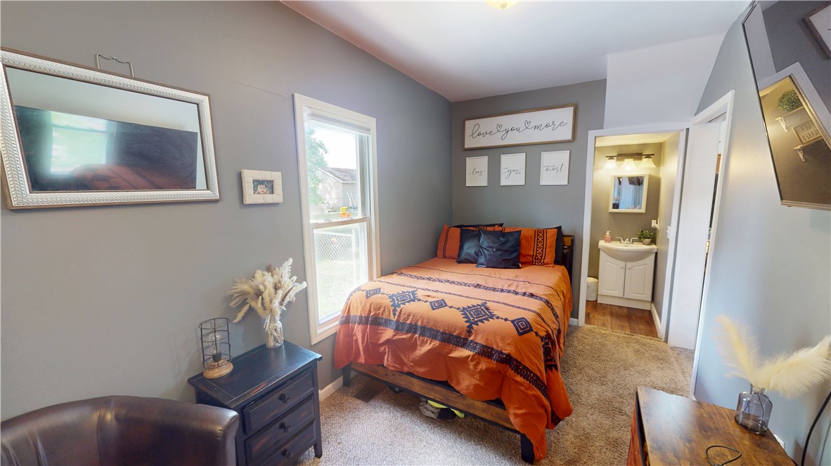8 Chestnut Street Danville, IL 61832 - Photo 12 of 19 a bedroom with a bed and wooden floor