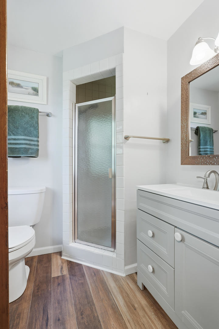 4314 Spring Street Davenport, IA 52807 - Photo 31 of 51 a bathroom with a sink a toilet and shower