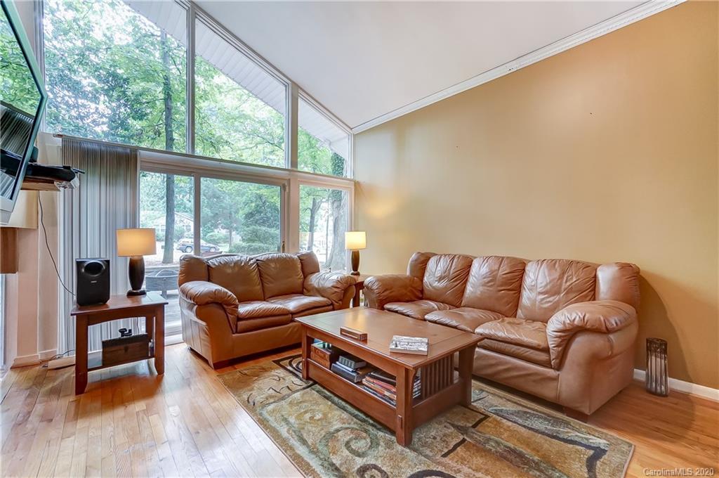 5314 Valley Forge Road Charlotte, NC 28210 - Photo 14 of 48 a living room with furniture a large window and a flat screen tv