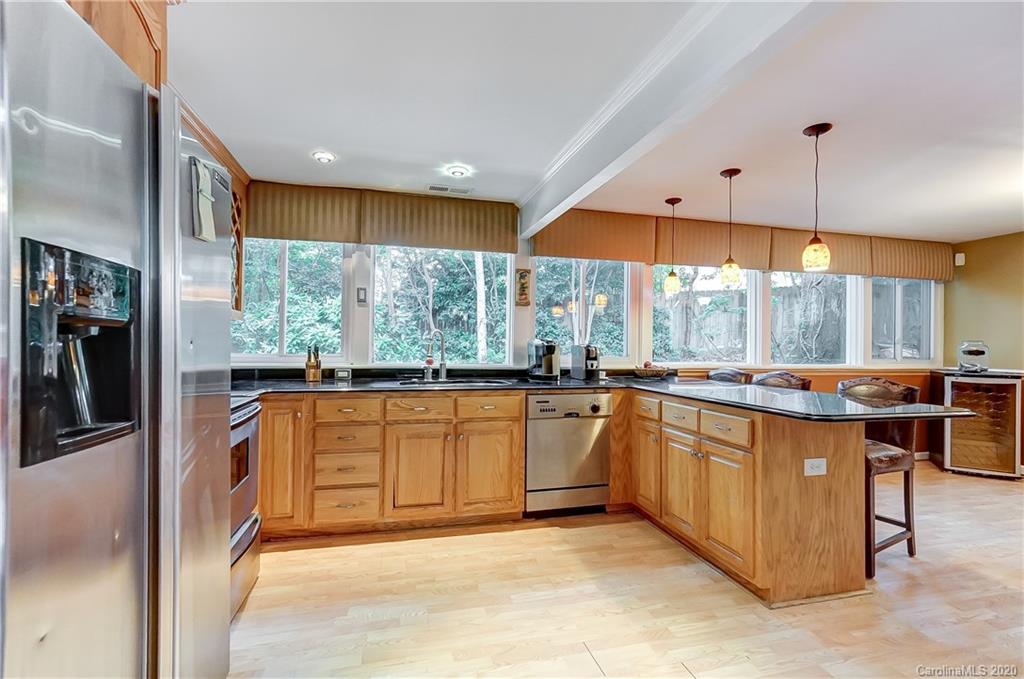 5314 Valley Forge Road Charlotte, NC 28210 - Photo 18 of 48 a kitchen with stainless steel appliances granite countertop a refrigerator a sink and a stove