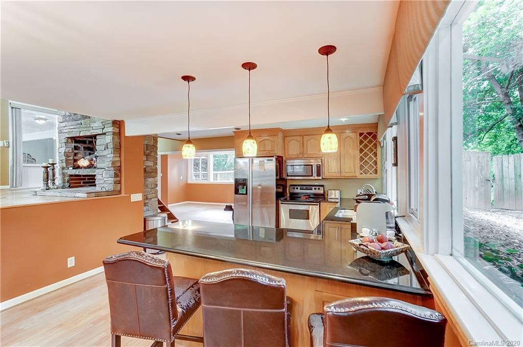 5314 Valley Forge Road Charlotte, NC 28210 - Photo 21 of 48 a room with table chairs and large windows