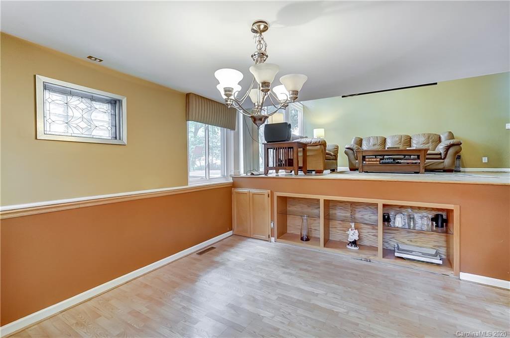 5314 Valley Forge Road Charlotte, NC 28210 - Photo 26 of 48 a view of a kitchen with a sink and a chandelier