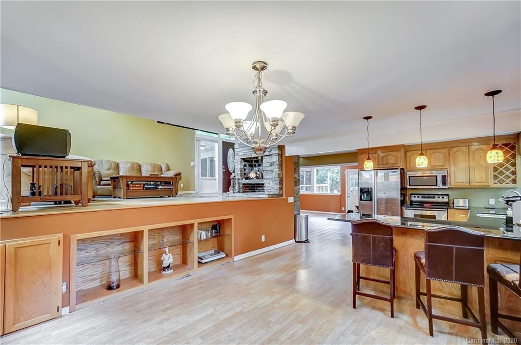 5314 Valley Forge Road Charlotte, NC 28210 - Photo 27 of 48 a large kitchen with a table and chairs in it