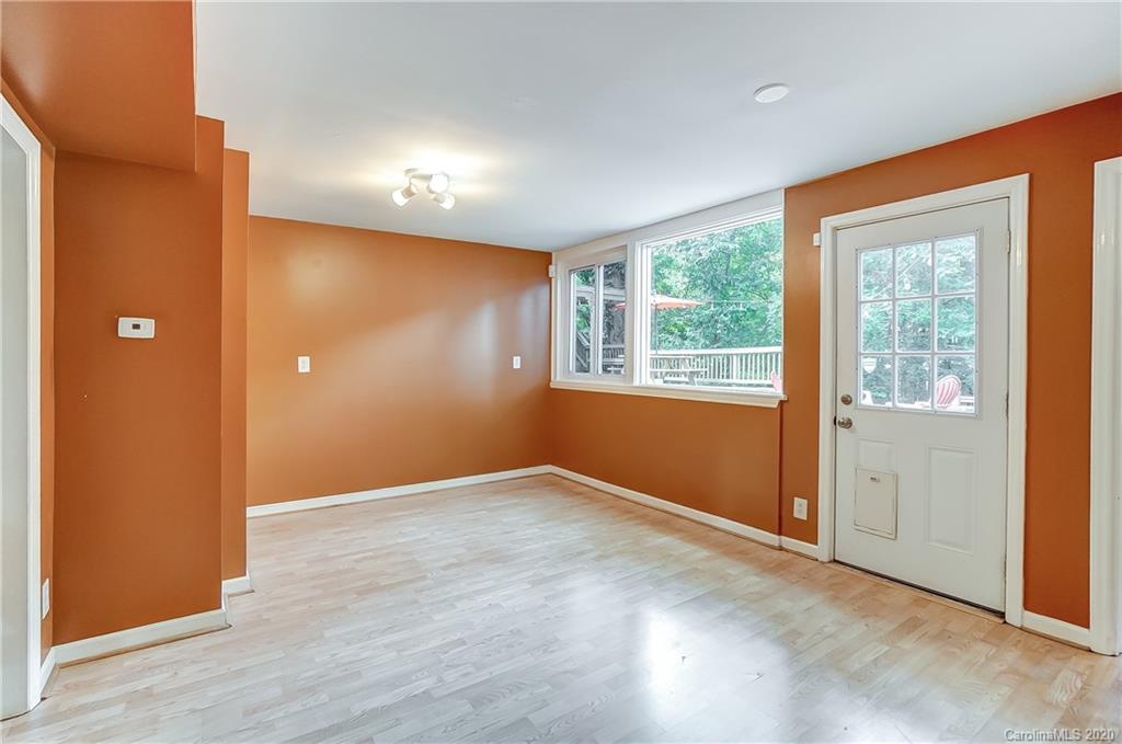 5314 Valley Forge Road Charlotte, NC 28210 - Photo 29 of 48 an empty room with wooden floor and windows