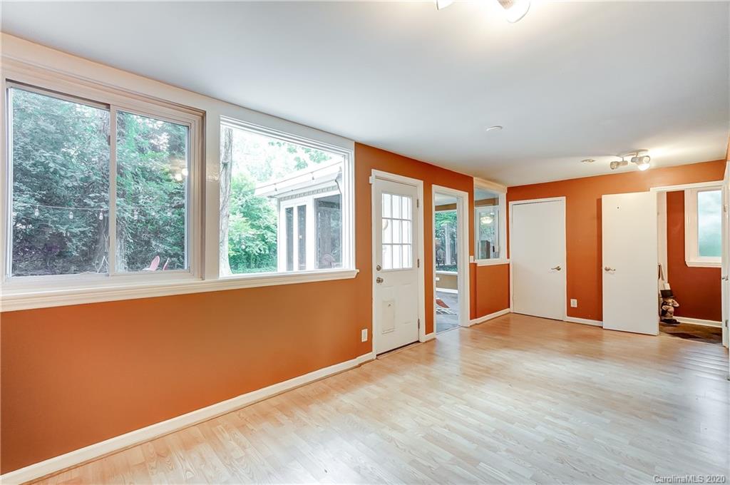 5314 Valley Forge Road Charlotte, NC 28210 - Photo 30 of 48 a view of an empty room with wooden floor and a window