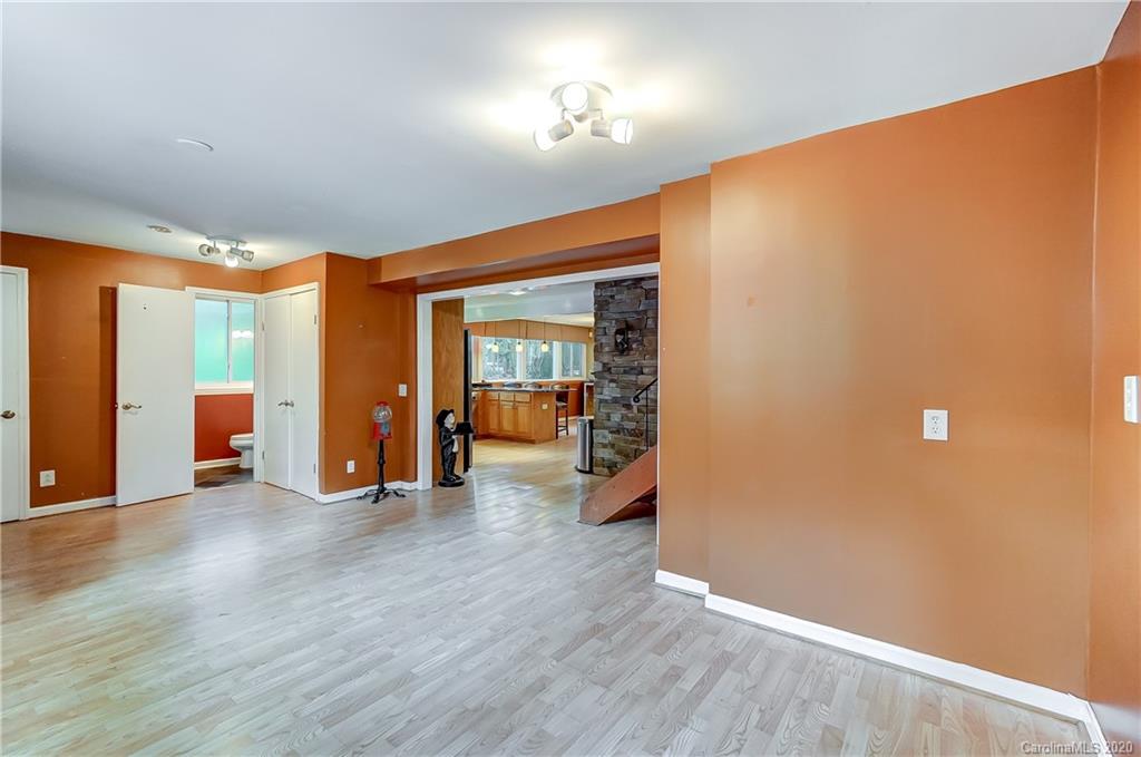 5314 Valley Forge Road Charlotte, NC 28210 - Photo 31 of 48 an empty room with wooden floor and windows