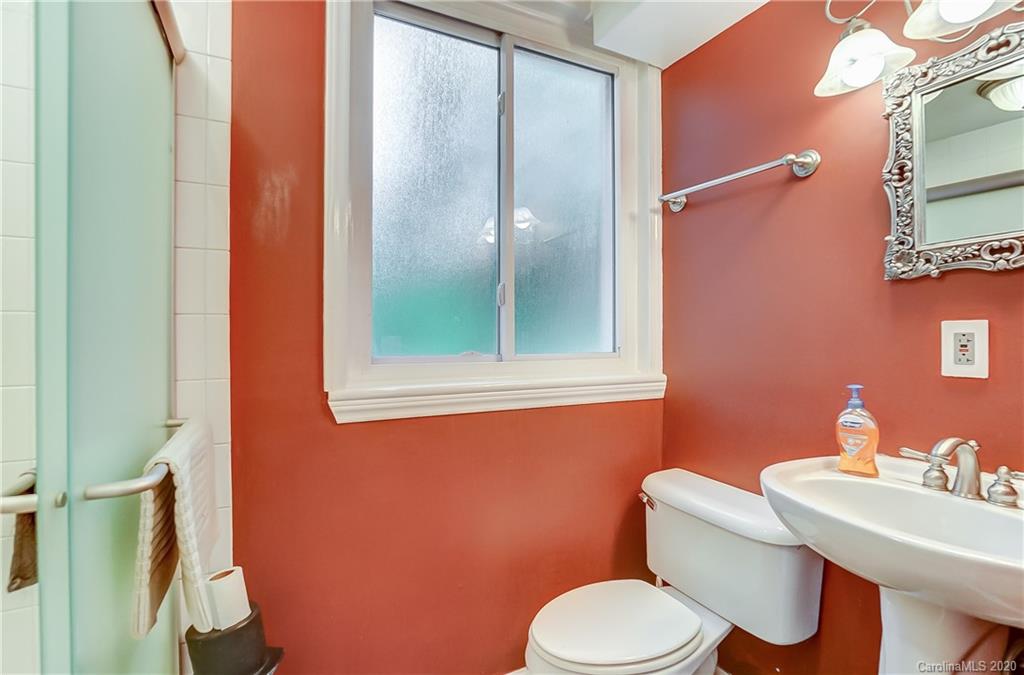 5314 Valley Forge Road Charlotte, NC 28210 - Photo 32 of 48 a white toilet sitting next to a bathroom sink