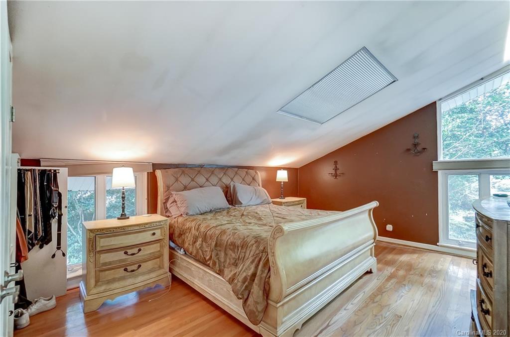 5314 Valley Forge Road Charlotte, NC 28210 - Photo 36 of 48 a bedroom with a bed and a large window