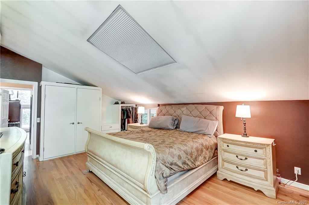 5314 Valley Forge Road Charlotte, NC 28210 - Photo 38 of 48 a bedroom with a bed and a night stand