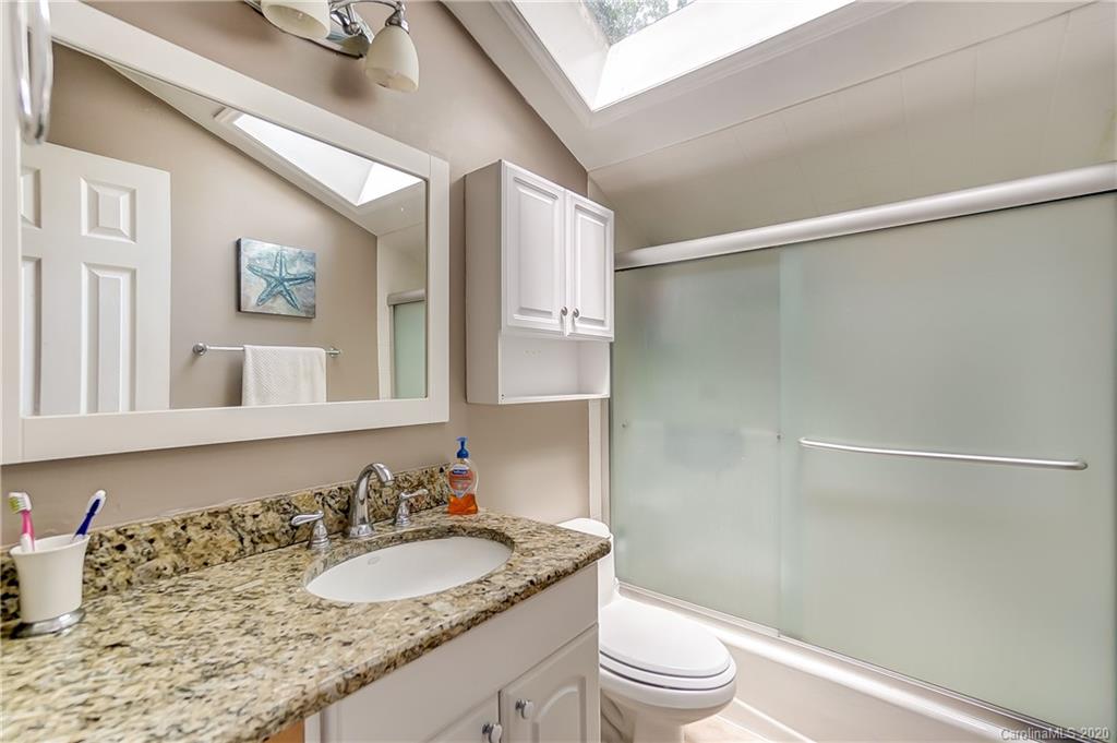 5314 Valley Forge Road Charlotte, NC 28210 - Photo 39 of 48 a bathroom with a granite countertop sink toilet and shower