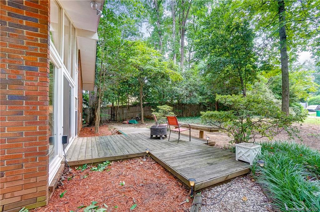 5314 Valley Forge Road Charlotte, NC 28210 - Photo 5 of 48 a view of backyard with seating space and trees