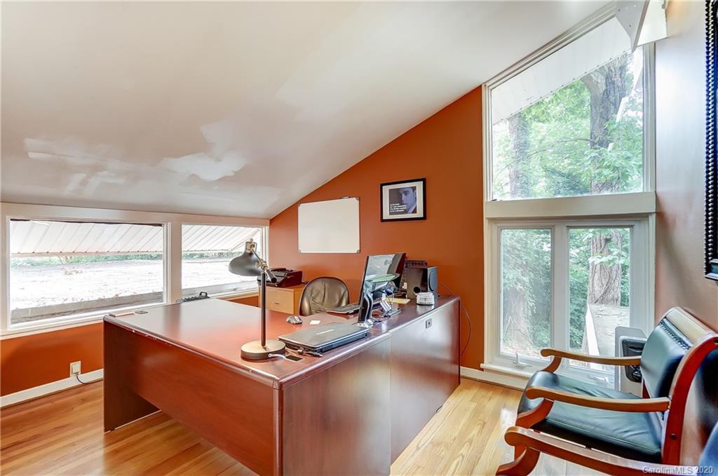5314 Valley Forge Road Charlotte, NC 28210 - Photo 41 of 48 a living room with furniture a rug potted plant and a large window