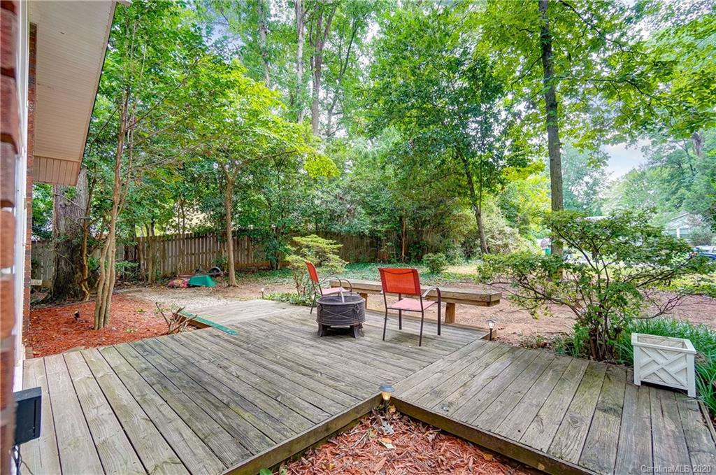 5314 Valley Forge Road Charlotte, NC 28210 - Photo 6 of 48 a wooden bench sitting on top of a wooden floor
