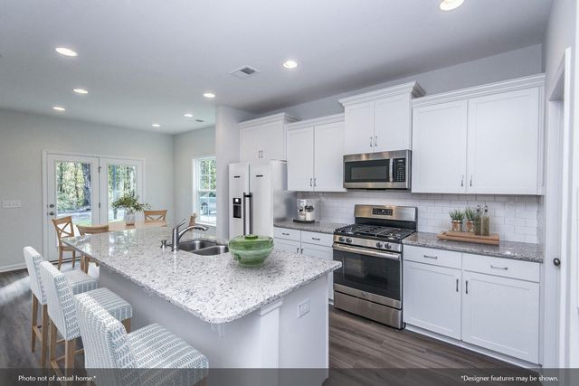 a view of swimming pool with outdoor seating and a yard