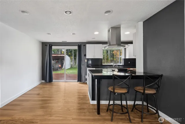 a kitchen with a table and chairs in it