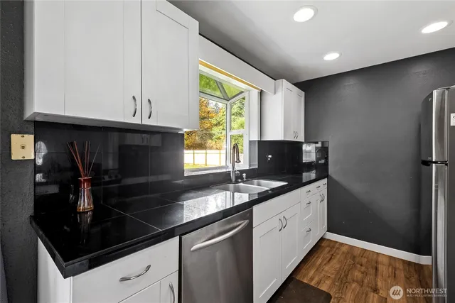 a kitchen with a sink and cabinets