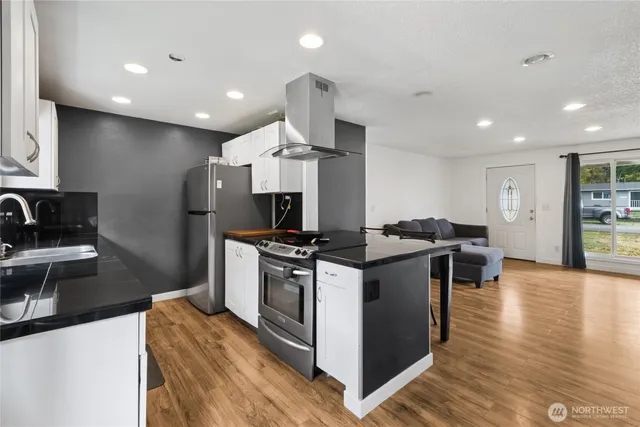 a kitchen with a stove and a refrigerator