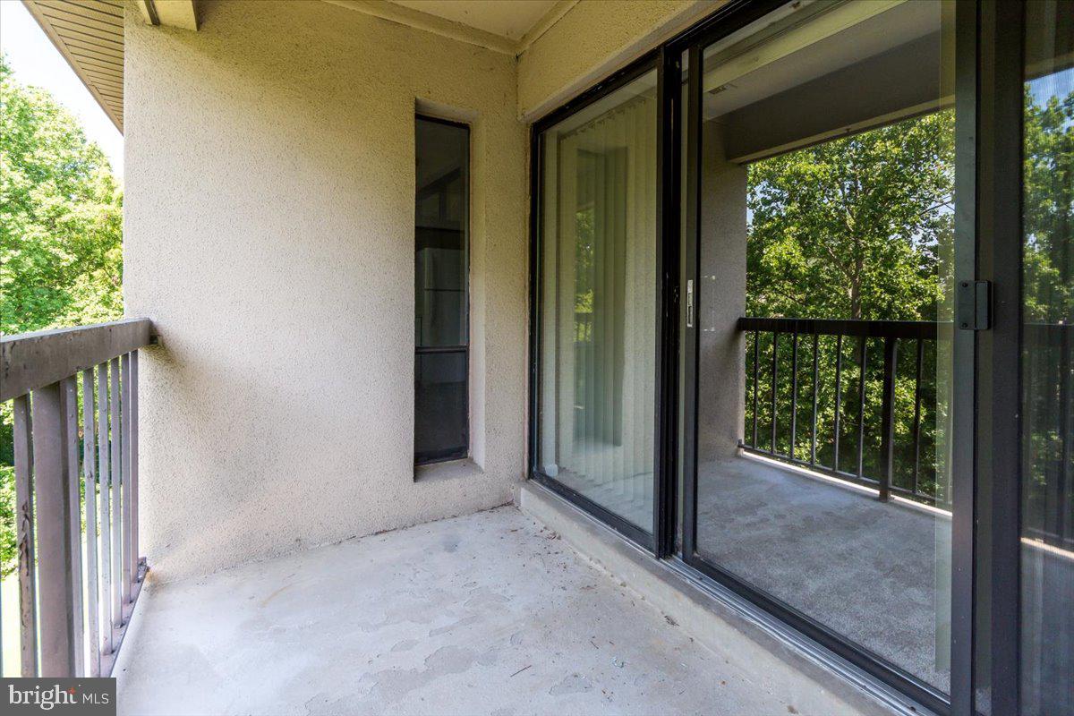 15710 Dorset Road, Unit 302 Laurel, MD 20707 - Photo 28 of 29 Balcony w/ Pick-a-Boo Window into the Kitchen