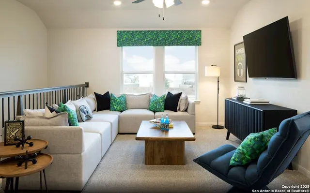 a living room with furniture fireplace and a flat screen tv