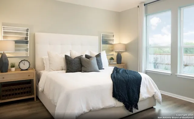 a bedroom with a bed and window