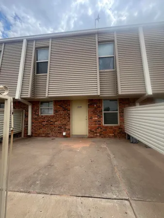 a view of a house with a yard and garage