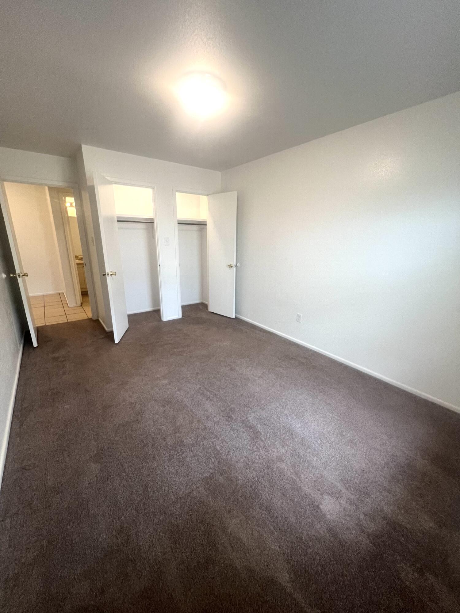802 Matthew Avenue Sundown, TX 79372 - Photo 20 of 22 an empty room with windows