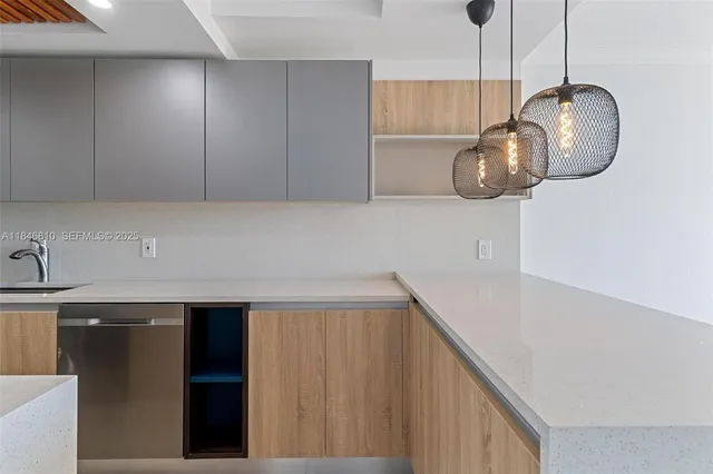 a kitchen with a cabinets and a chandelier