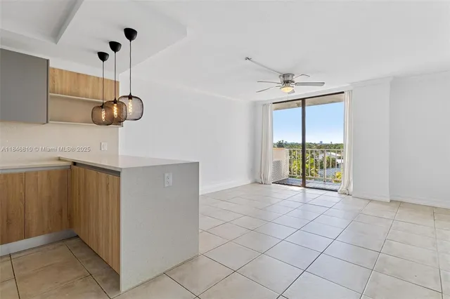 an aerial view of a houses with a lake view