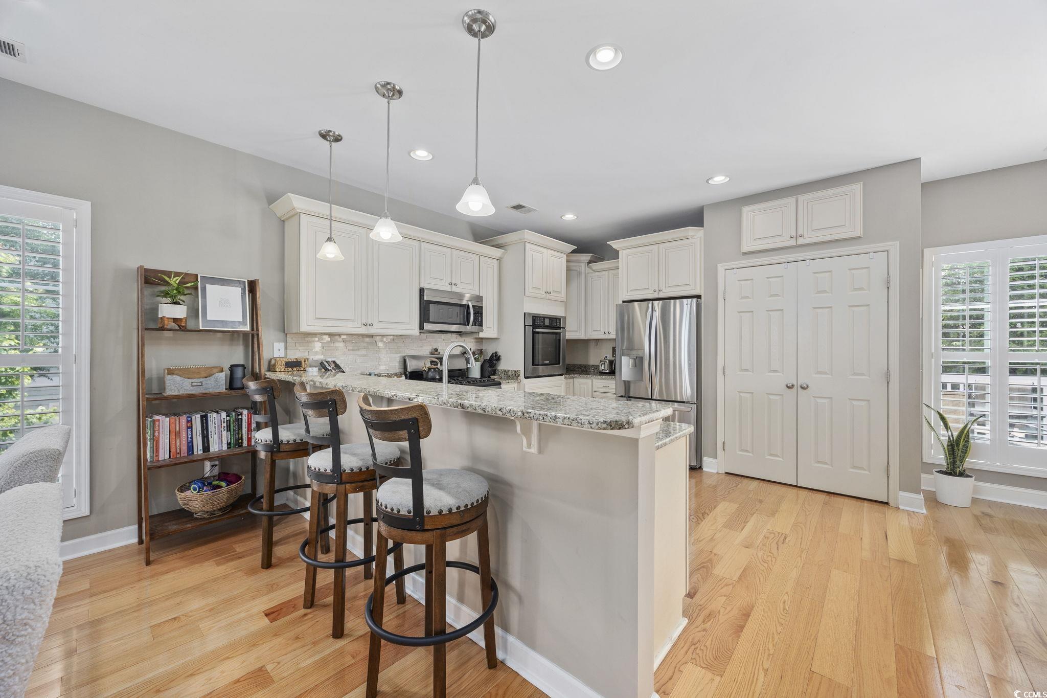175 SummerWind Loop Murrells Inlet, SC 29576 - Photo 12 of 39 Kitchen with stainless steel appliances, a peninsu