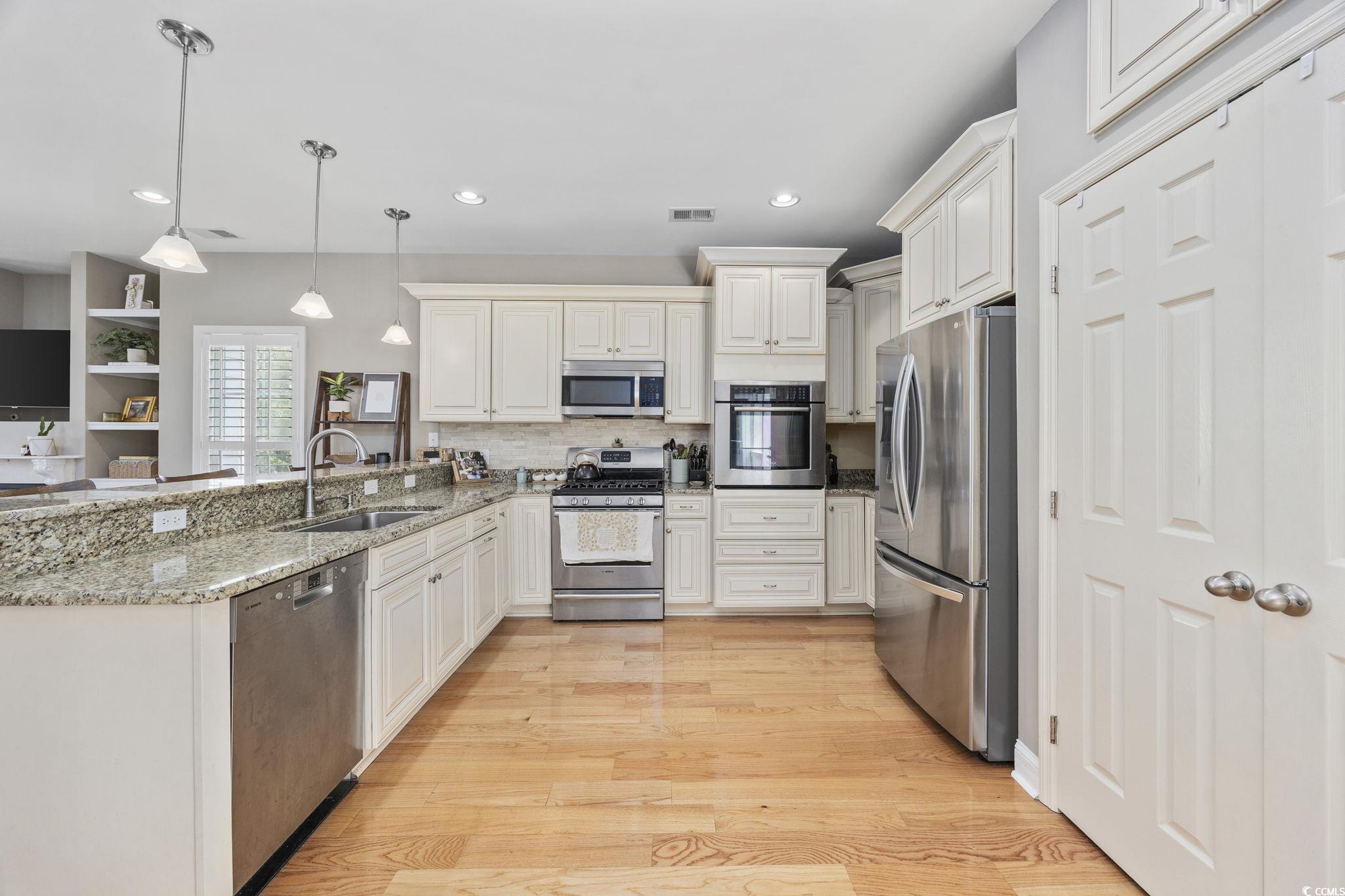 175 SummerWind Loop Murrells Inlet, SC 29576 - Photo 13 of 39 Kitchen featuring stainless steel appliances, a si
