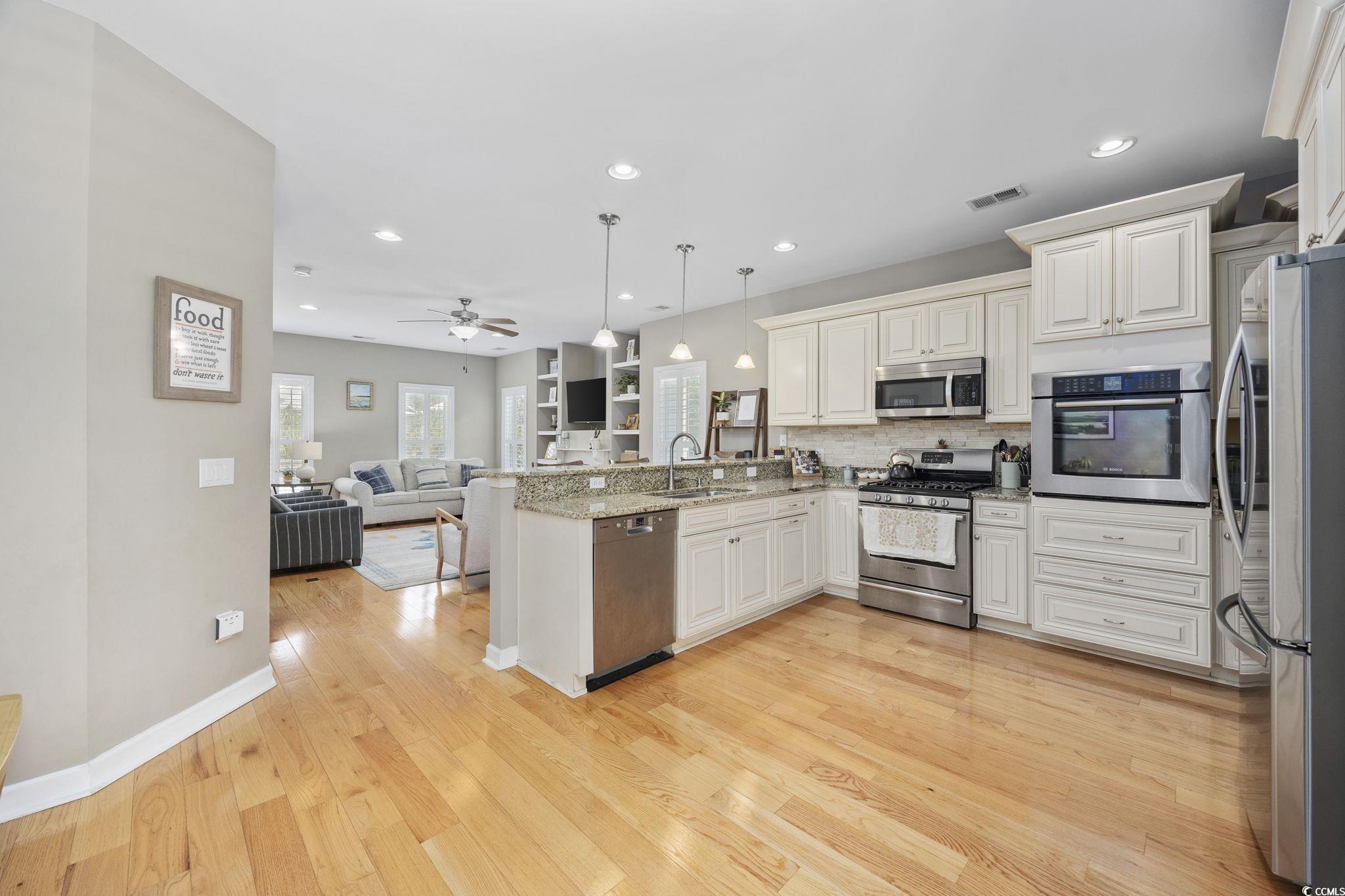 175 SummerWind Loop Murrells Inlet, SC 29576 - Photo 14 of 39 Kitchen with stainless steel appliances, a sink, a