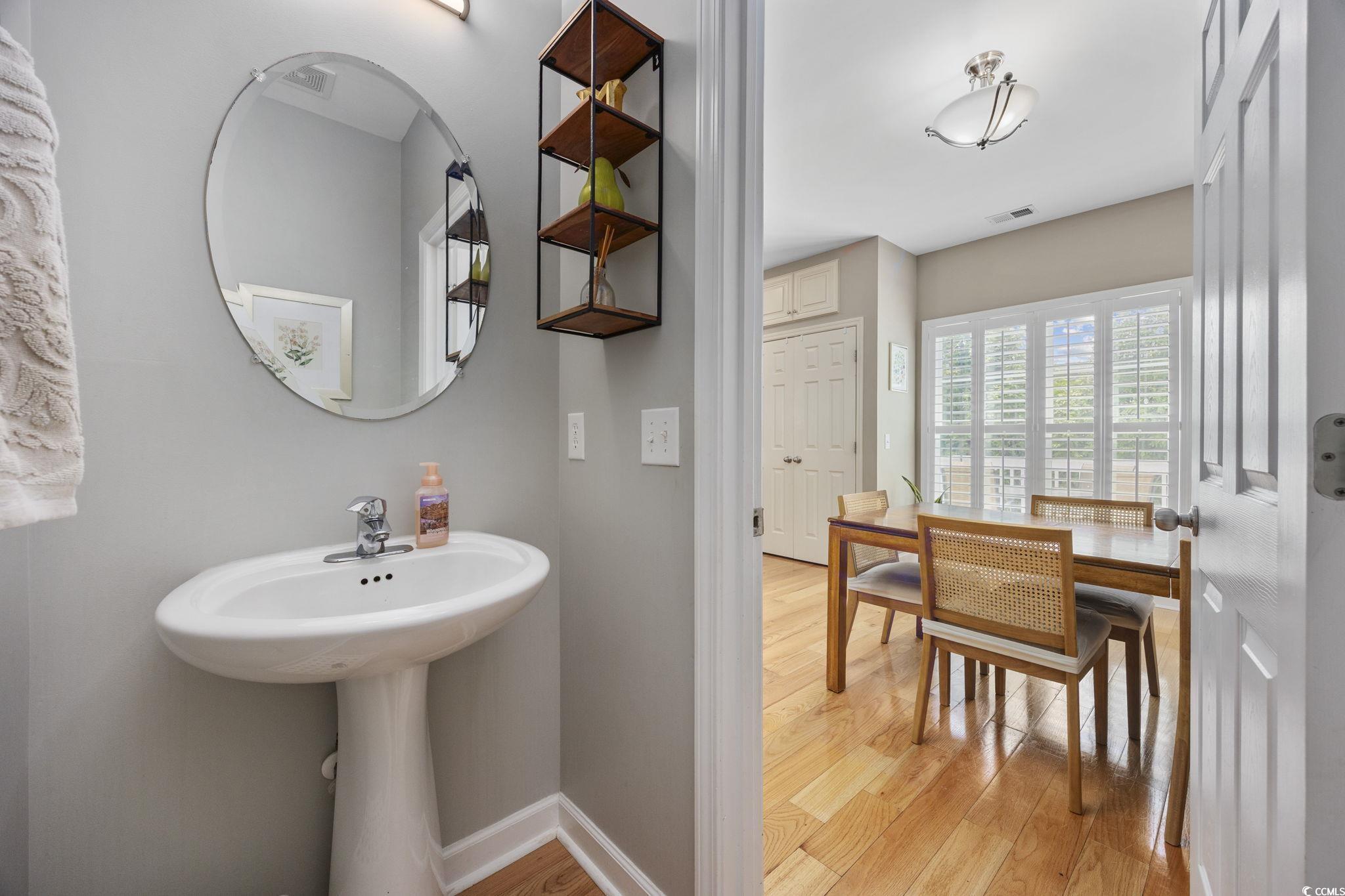175 SummerWind Loop Murrells Inlet, SC 29576 - Photo 16 of 39 Bathroom featuring wood finished floors and basebo