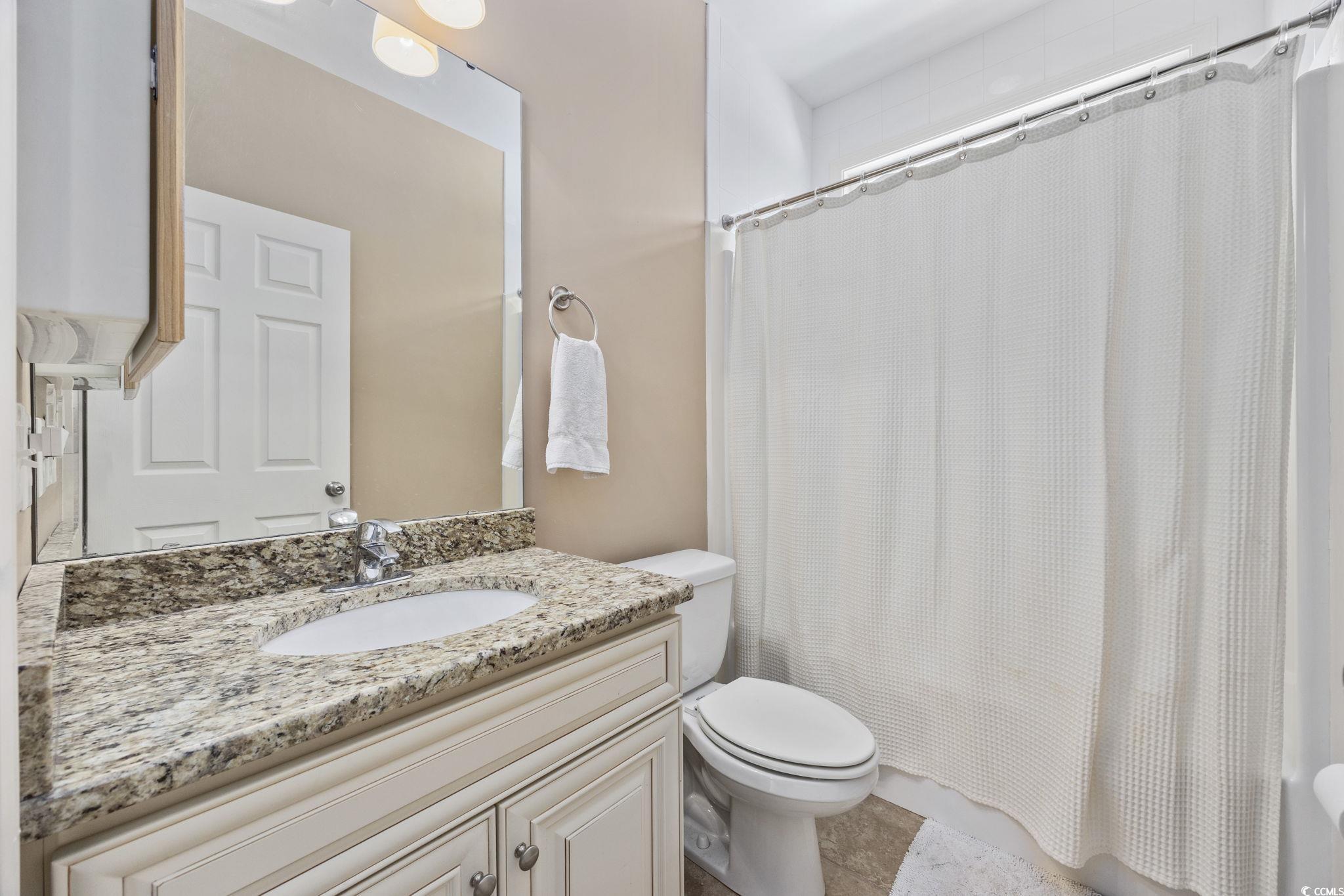 175 SummerWind Loop Murrells Inlet, SC 29576 - Photo 20 of 39 Bathroom featuring toilet, vanity, and shower / ba