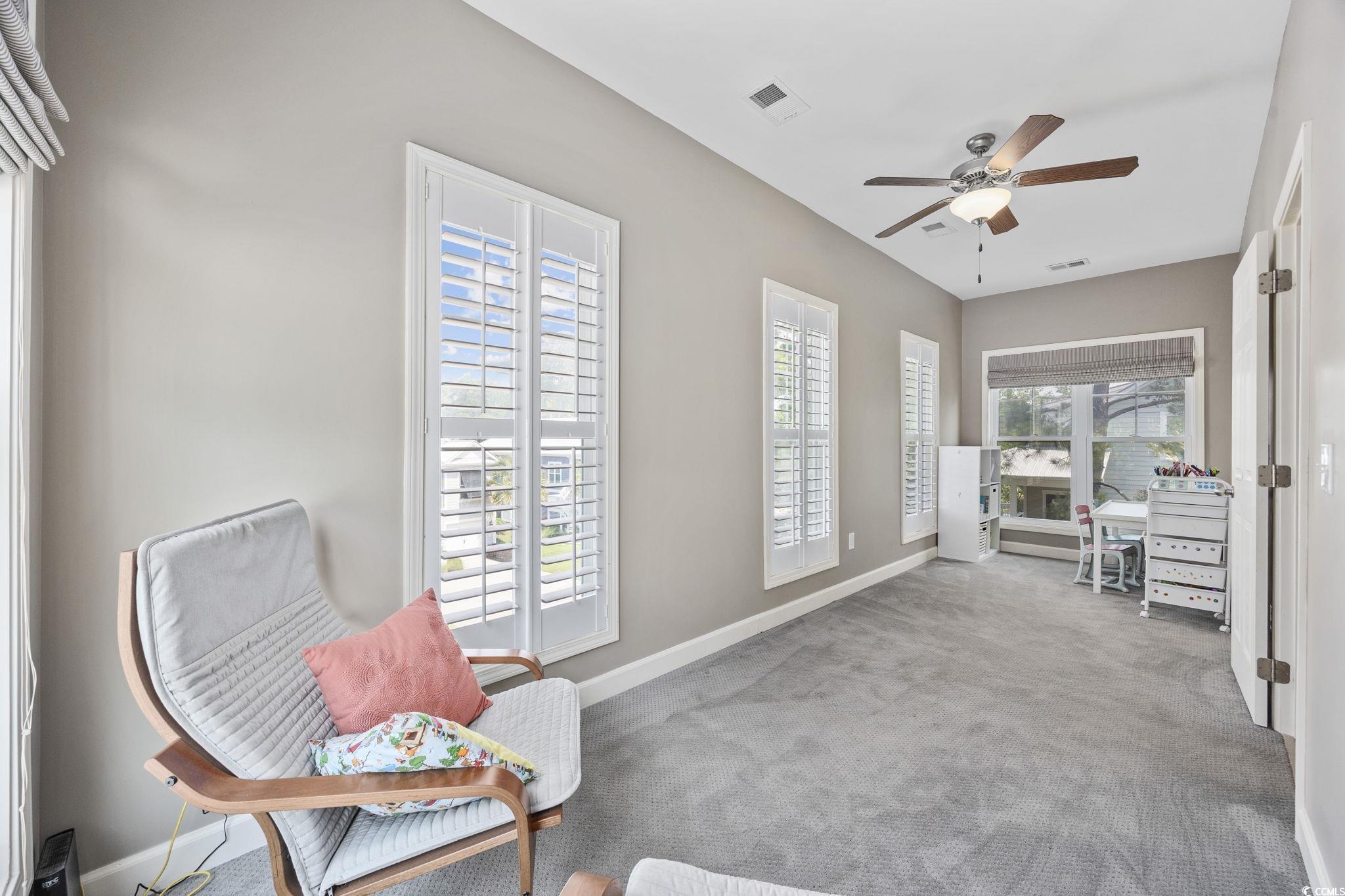 175 SummerWind Loop Murrells Inlet, SC 29576 - Photo 21 of 39 Living area featuring baseboards, a ceiling fan, a