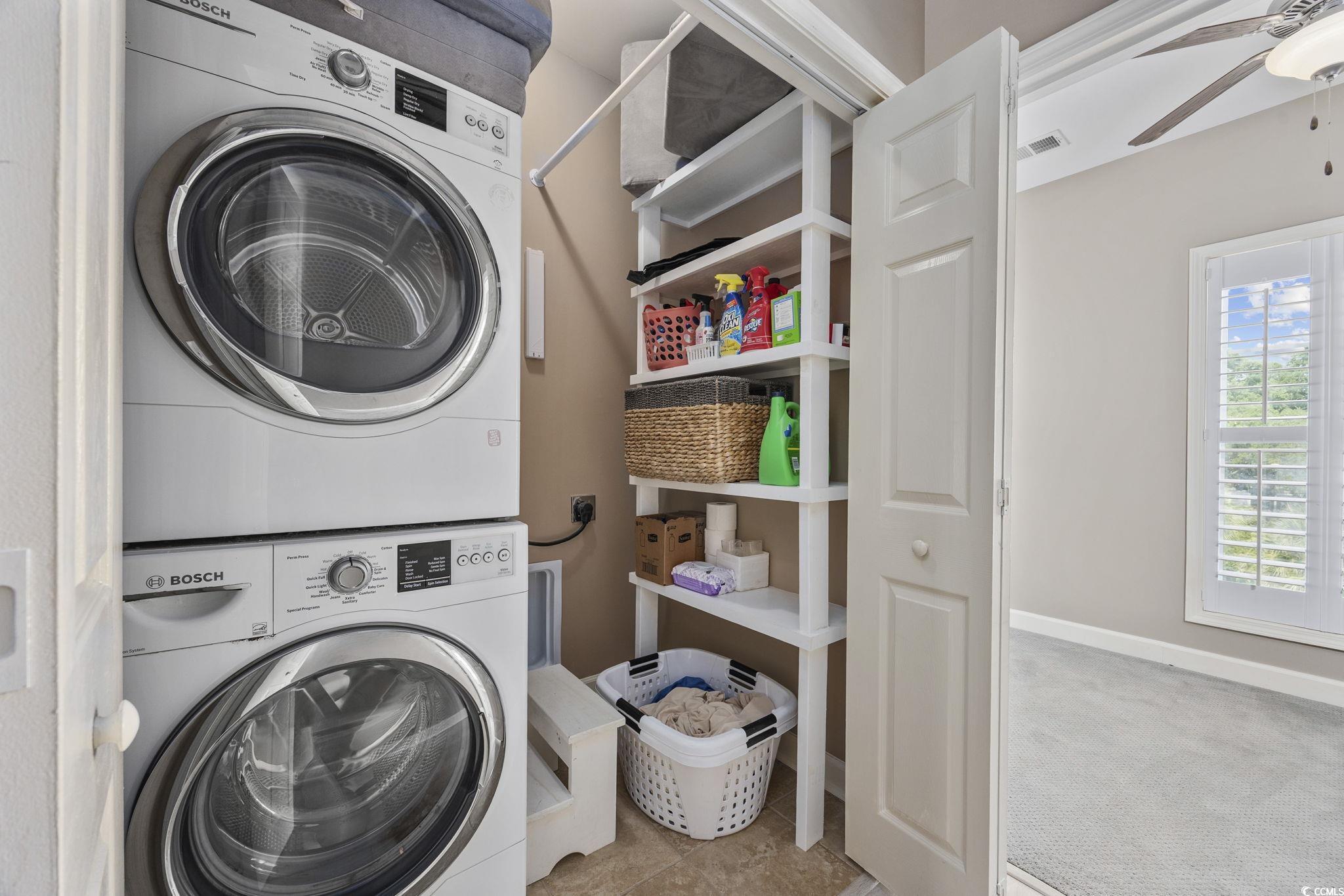 175 SummerWind Loop Murrells Inlet, SC 29576 - Photo 23 of 39 Laundry area featuring stacked washer and clothes