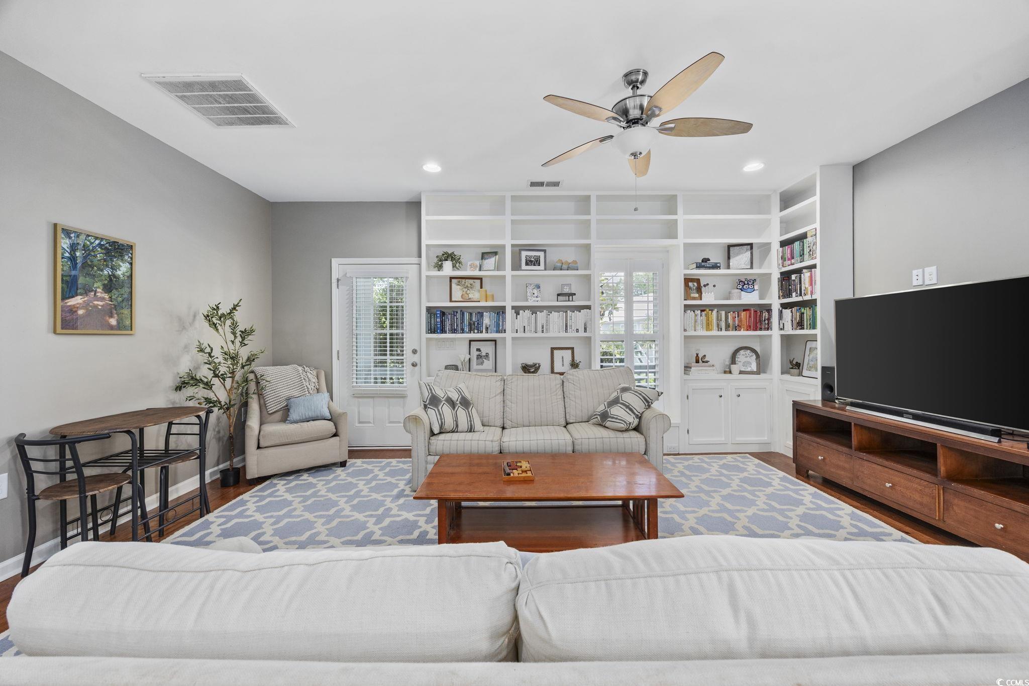 175 SummerWind Loop Murrells Inlet, SC 29576 - Photo 24 of 39 Living area featuring a ceiling fan, wood finished