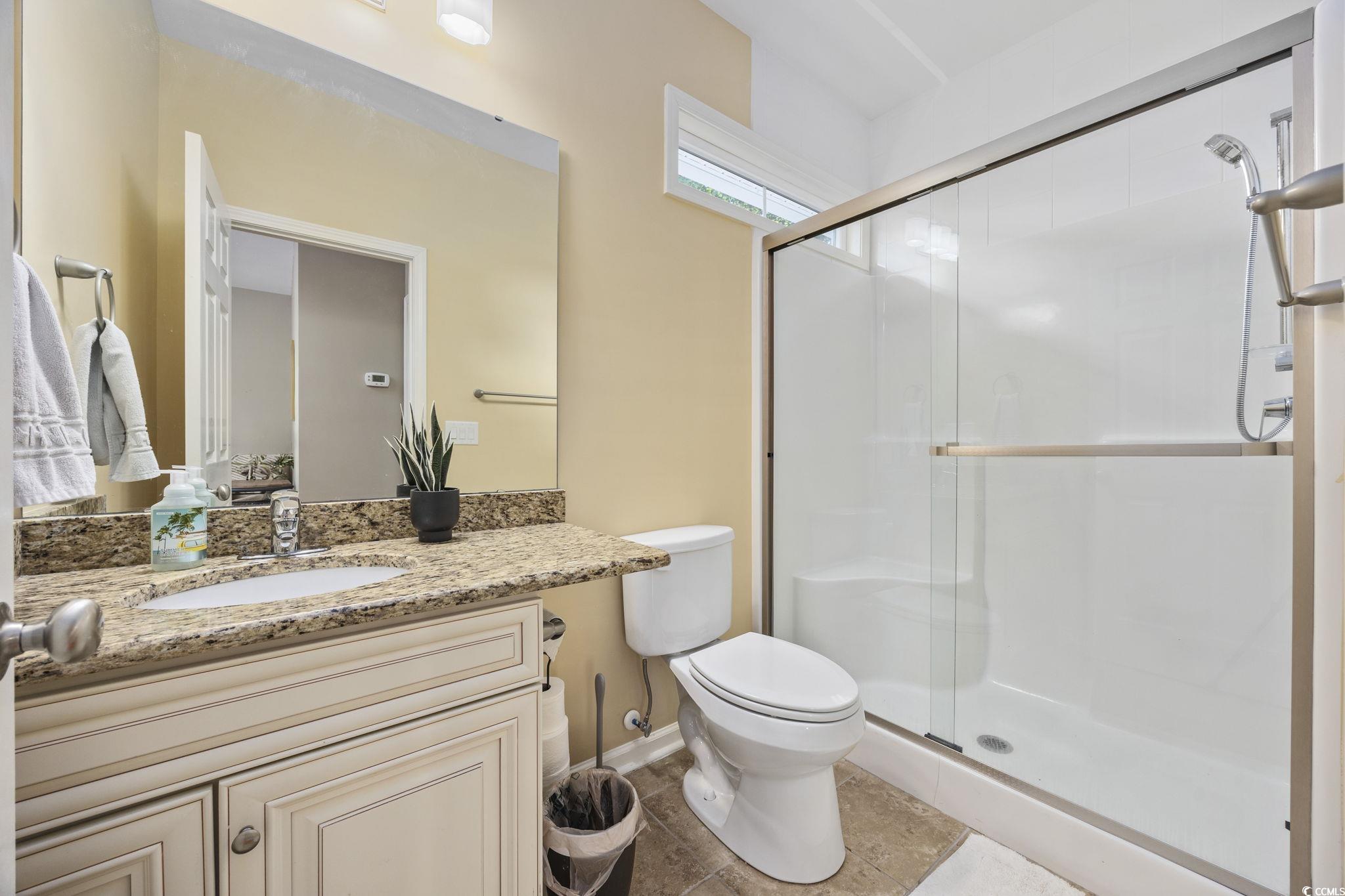 175 SummerWind Loop Murrells Inlet, SC 29576 - Photo 29 of 39 Full bath featuring a stall shower, toilet, vanity