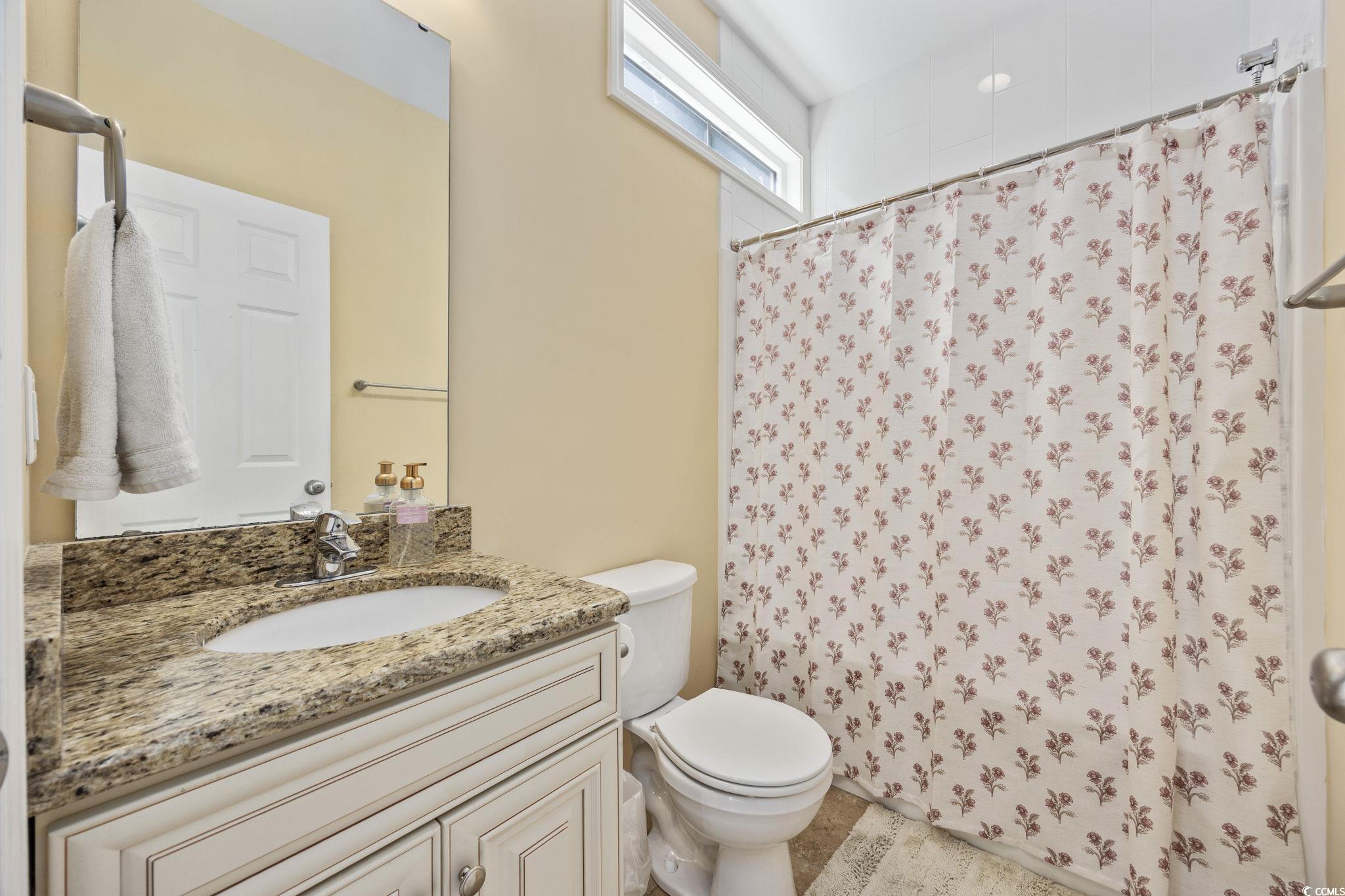 175 SummerWind Loop Murrells Inlet, SC 29576 - Photo 31 of 39 Bathroom featuring toilet, vanity, and a shower wi