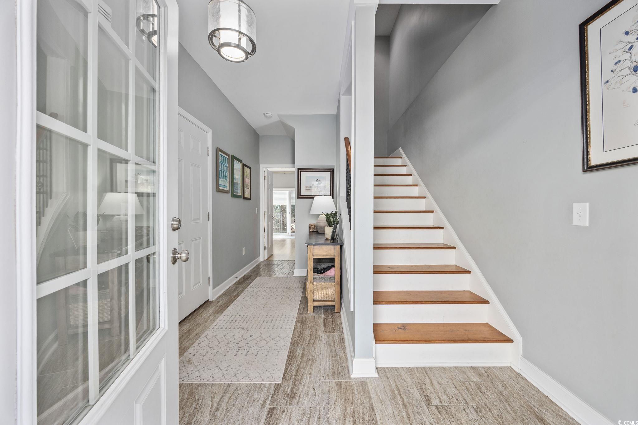175 SummerWind Loop Murrells Inlet, SC 29576 - Photo 5 of 39 Foyer with stairs and baseboards