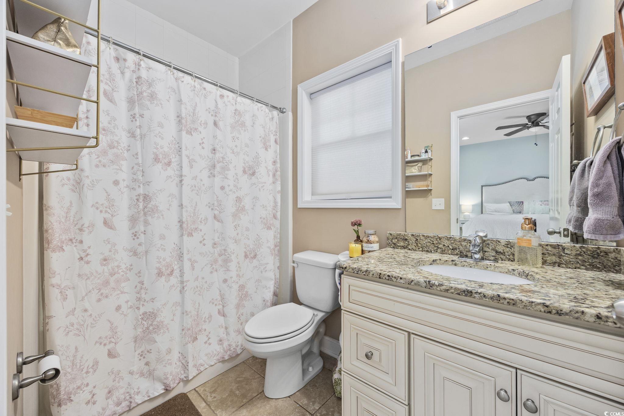 175 SummerWind Loop Murrells Inlet, SC 29576 - Photo 7 of 39 Ensuite bathroom with vanity, toilet, tile pattern