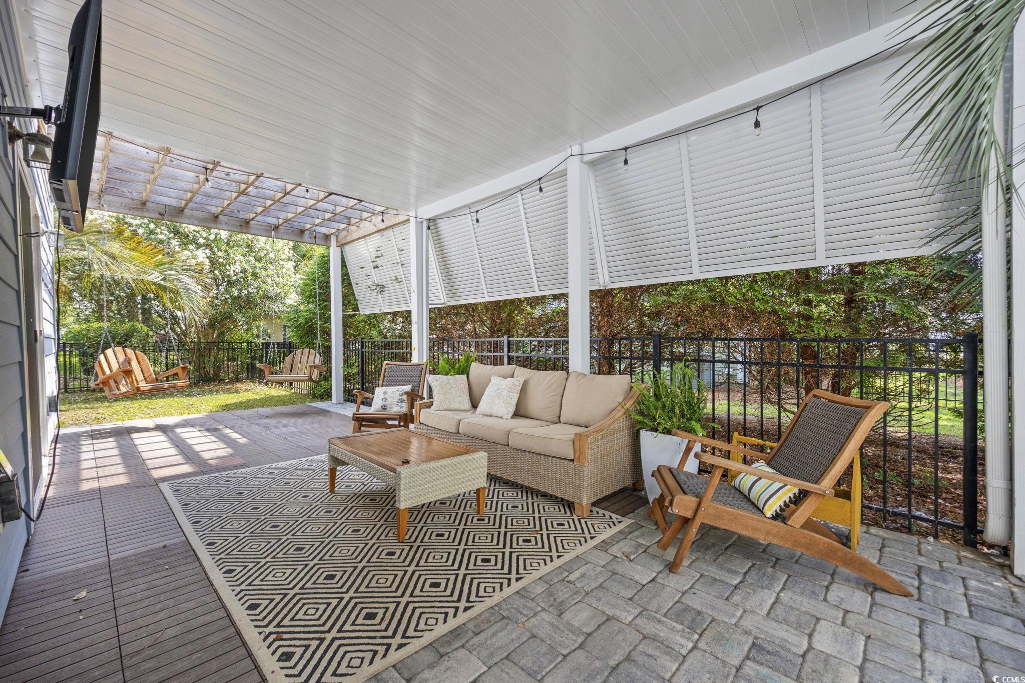 175 SummerWind Loop Murrells Inlet, SC 29576 - Photo 9 of 39 Fenced backyard with outdoor lounge area