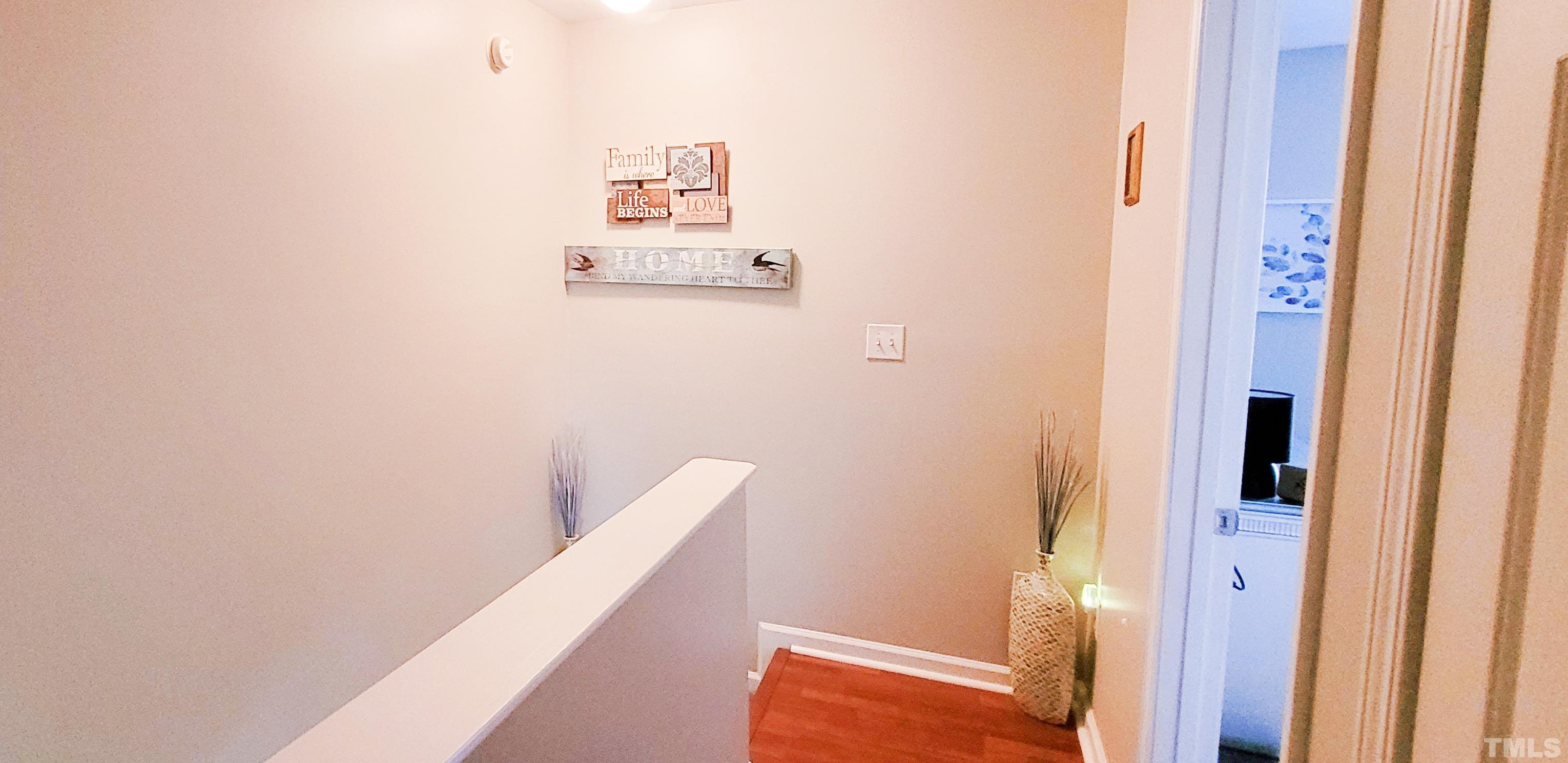2109 Persimmon Ridge Drive Raleigh, NC 27604 - Photo 15 of 15 a view of a hallway with seating area